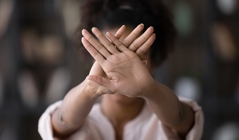 covering face with hands